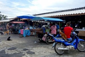 Food stalls on traditional market in Thailand by Authentic World Food