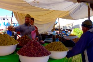 Olive vendor on traditional Moroccan market, souk - by Authentic World Food