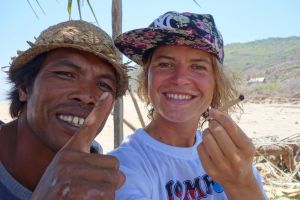 Bo` on the road and local farmer enjoying fresh tobacco wrapped in corn leaf - Lombok, Indonesia