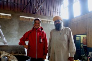 Bo on the road with chapatti baker in Golden temple, Amritsar, India