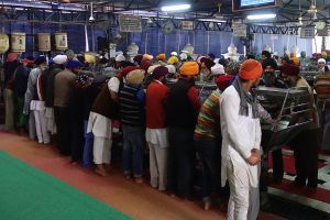 Washing area where men and women work separately, Golden temple, Amritsar, India