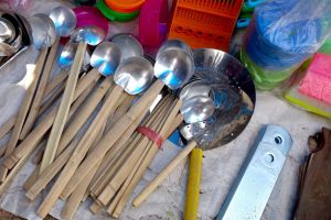 Kitchen tools vendor in Indonesia. The one with yellow handle is used for manipulating with Phuyng hay - Chinese omelette during frying - by Authentic World Food