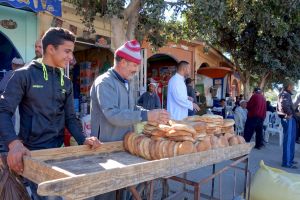 Moroccan bread (khobz) vendors on the street in Morocco by Authentic World Food