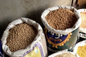 Vendor with chicpeas and other legumes in Delhi, India by Authentic World Food