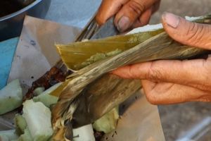 Lontong - rice cakes cooked in a banana leaf