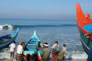 Surfing in a fishing village in Kerala, India.