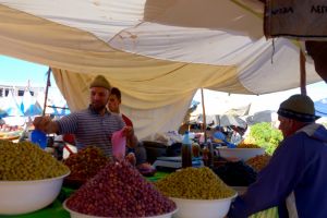 Olives vendor on traditional Moroccan market souk - by Authentic World Food